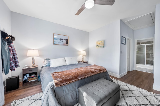 bedroom with ceiling fan, dark wood-type flooring, and baseboards