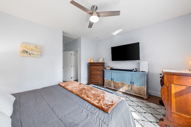 bedroom with ceiling fan and wood finished floors