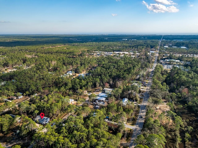 aerial view featuring a forest view