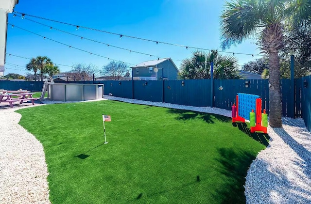 view of yard featuring a fenced in pool