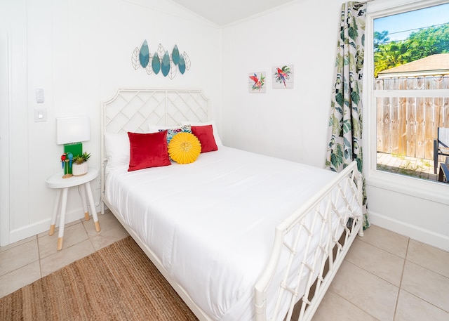 tiled bedroom with multiple windows