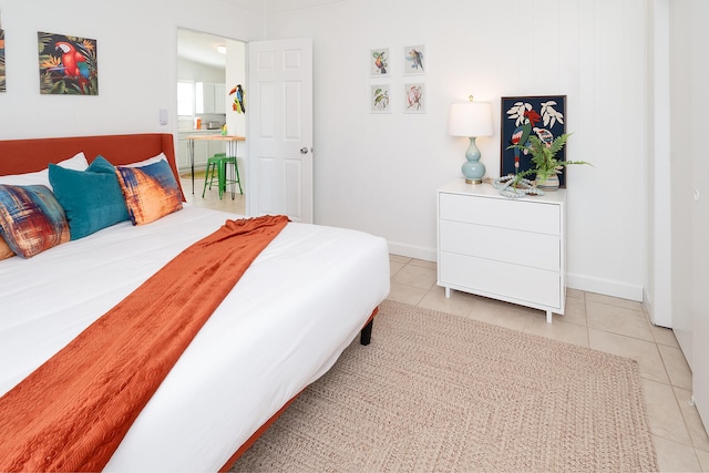 bedroom with light tile patterned floors