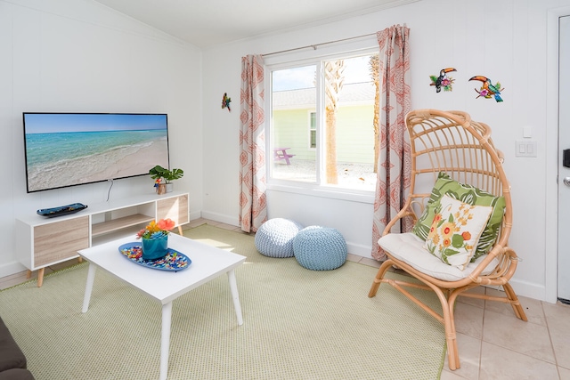 sitting room with light tile patterned floors and lofted ceiling