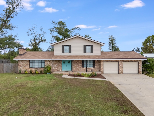 view of property with a front yard and a garage