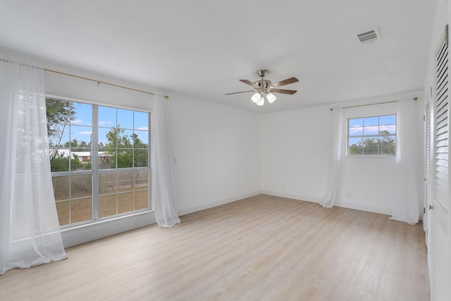 unfurnished room featuring ceiling fan and light hardwood / wood-style flooring