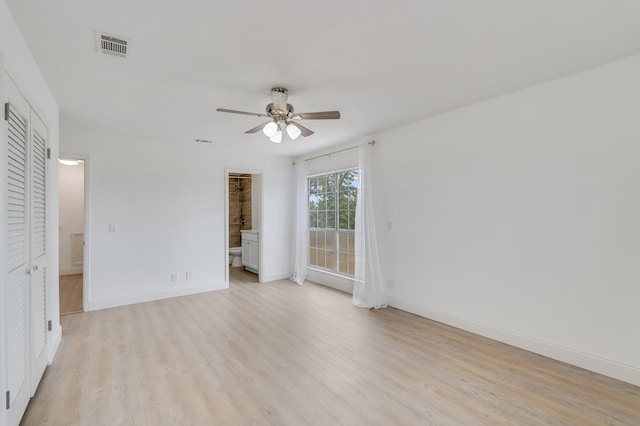 spare room featuring ceiling fan and light hardwood / wood-style floors