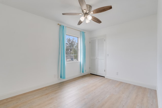 empty room featuring ceiling fan and light hardwood / wood-style floors