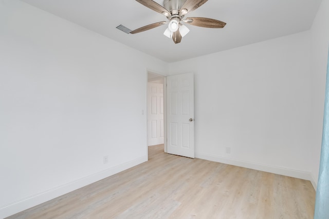 empty room with light hardwood / wood-style flooring and ceiling fan