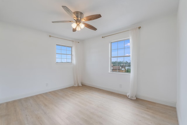 spare room featuring ceiling fan and light hardwood / wood-style floors