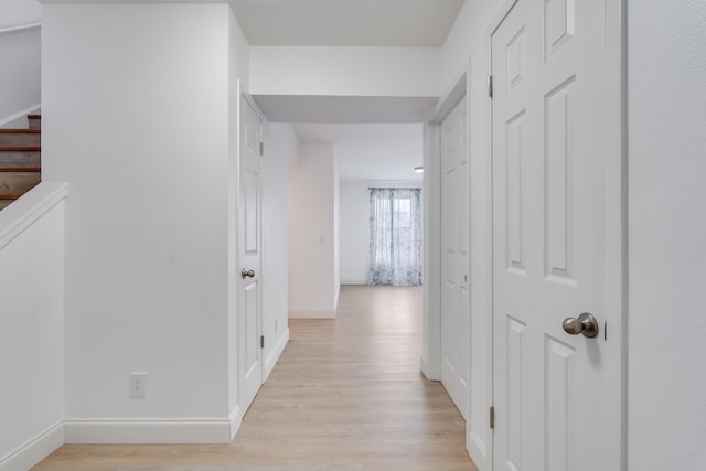 hall with light hardwood / wood-style floors