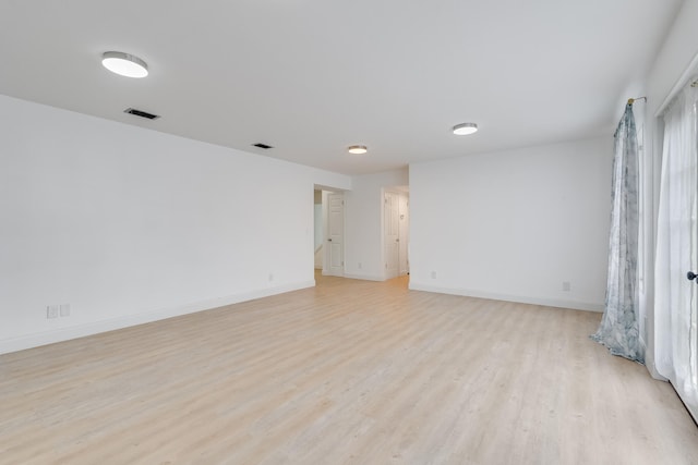 unfurnished room with light hardwood / wood-style floors