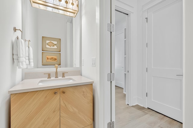 bathroom featuring vanity and hardwood / wood-style flooring