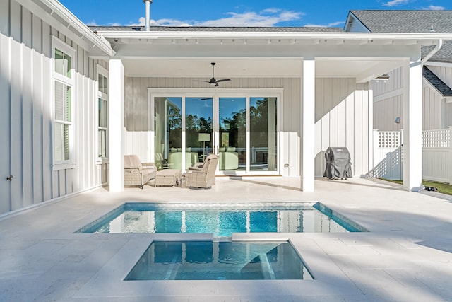 back of house with ceiling fan, a swimming pool with hot tub, a patio area, and an outdoor living space