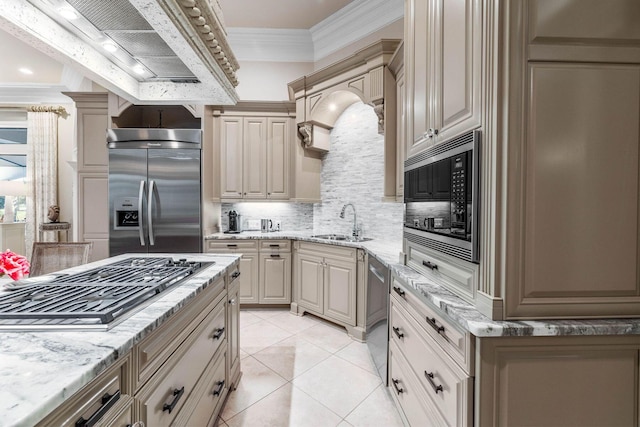 3400 Ravenwood Ln, Miramar Beach, FL 32550 - kitchen featuring stainless steel appliances, a sink, decorative backsplash, custom range hood, and crown molding