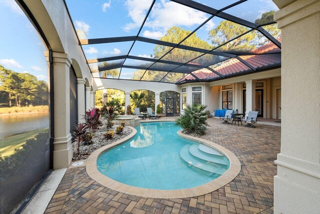 view of pool featuring a lanai and a patio area