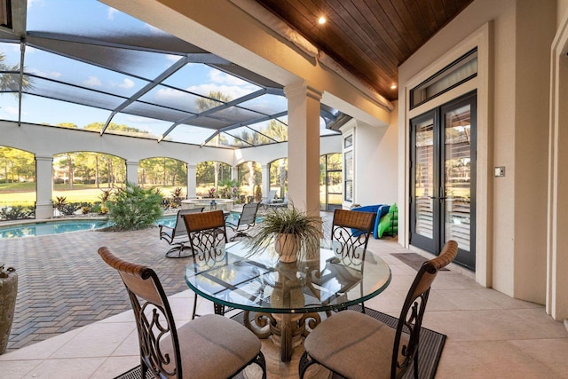3400 Ravenwood Ln, Miramar Beach, FL 32550 - view of patio featuring outdoor dining area, an outdoor pool, glass enclosure, and french doors