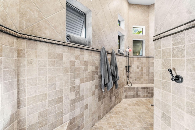 bathroom with a tile shower