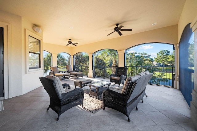 view of patio featuring an outdoor living space and ceiling fan