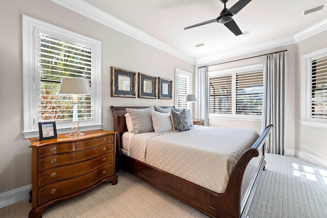 bedroom featuring light colored carpet, ceiling fan, and ornamental molding