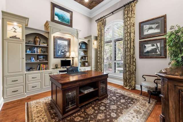 3400 Ravenwood Ln, Miramar Beach, FL 32550 - office with a high ceiling, ornamental molding, dark wood-style floors, baseboards, and built in shelves