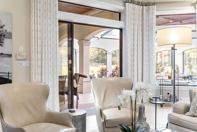 3400 Ravenwood Ln, Miramar Beach, FL 32550 - living area with ornate columns, tile patterned floors, and arched walkways