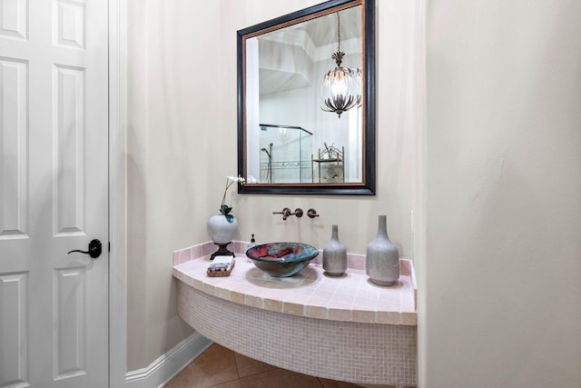 3400 Ravenwood Ln, Miramar Beach, FL 32550 - bathroom with a sink, tile patterned floors, and baseboards