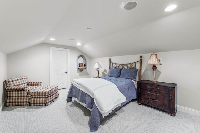 bedroom with light carpet and vaulted ceiling