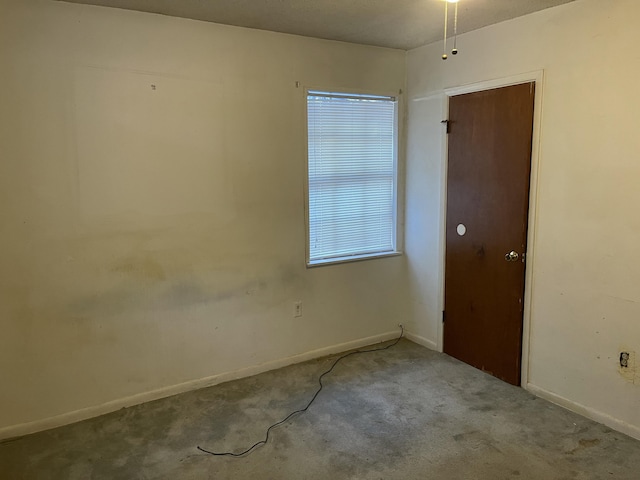 spare room featuring light colored carpet