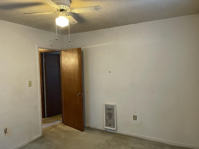 unfurnished room featuring a textured ceiling and ceiling fan