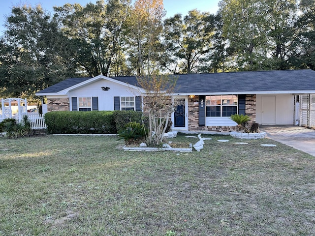 single story home featuring a carport and a front yard