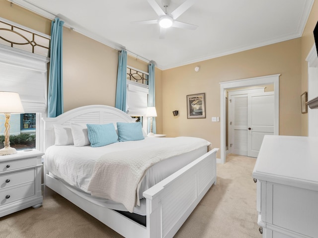 bedroom featuring light carpet, ceiling fan, and ornamental molding