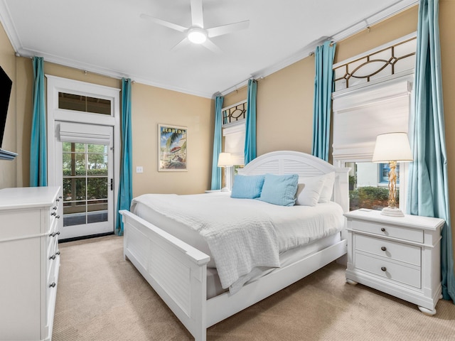 carpeted bedroom featuring access to exterior, ceiling fan, and ornamental molding