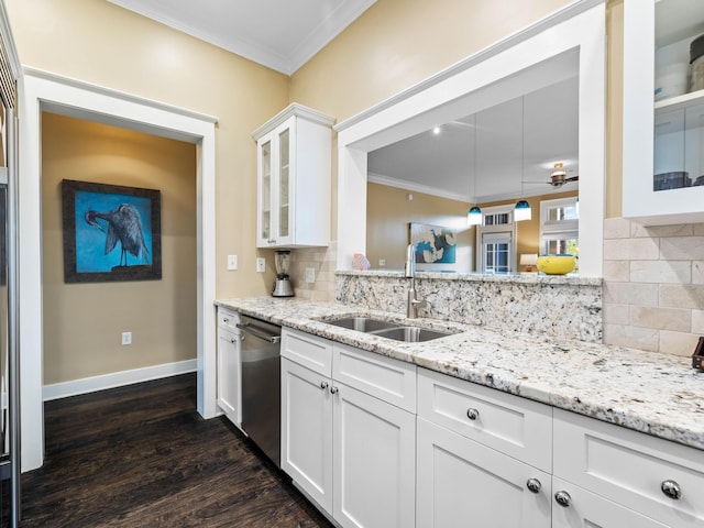 kitchen featuring dark hardwood / wood-style flooring, tasteful backsplash, crown molding, sink, and white cabinetry