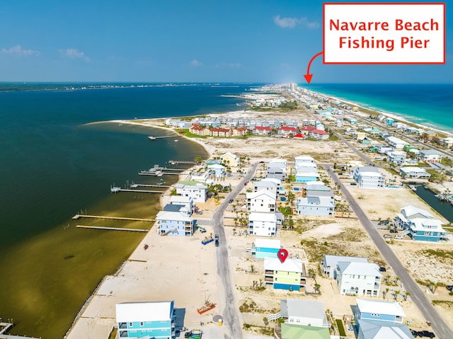 bird's eye view with a water view and a view of the beach