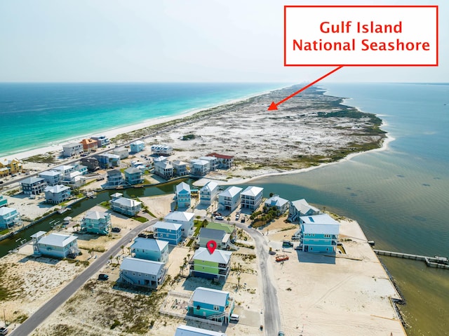 bird's eye view with a beach view and a water view