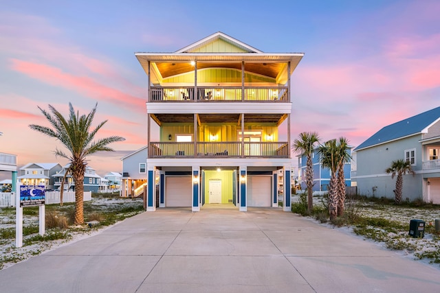 coastal home with a balcony and a garage