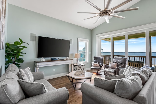 living room with ceiling fan, vaulted ceiling, and wood-type flooring