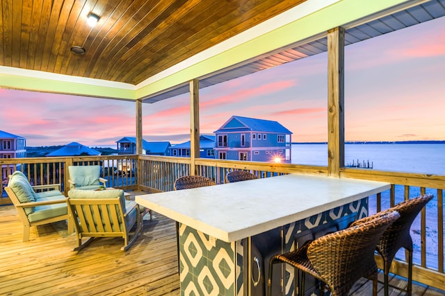 exterior space featuring wood ceiling and a water view