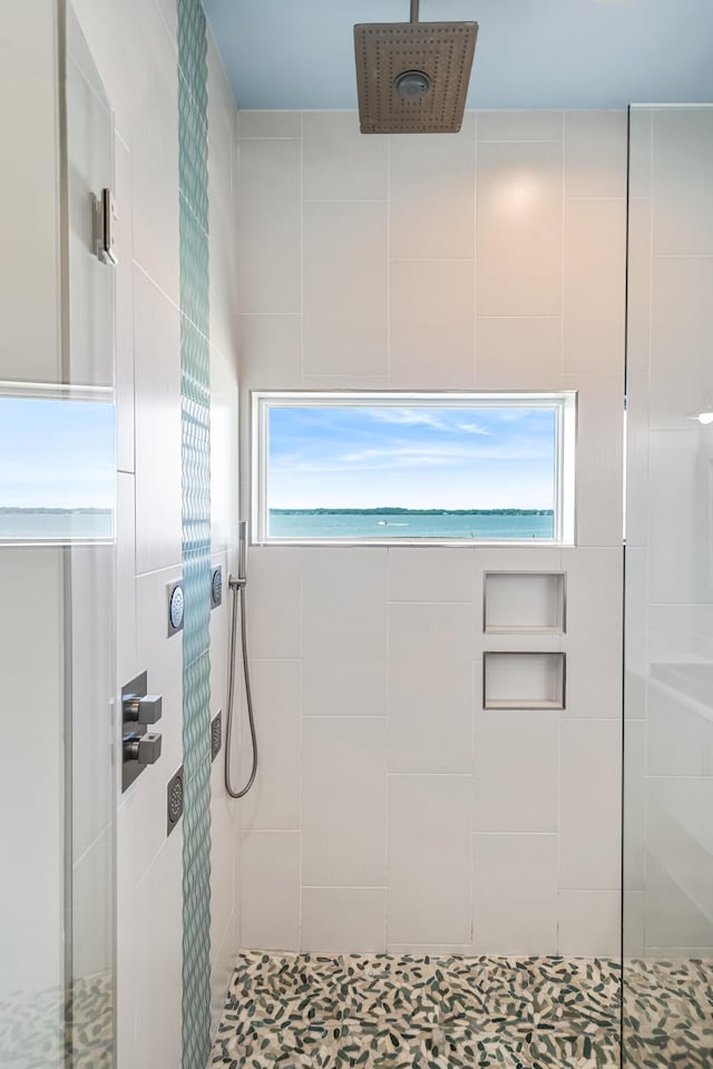 bathroom with tiled shower