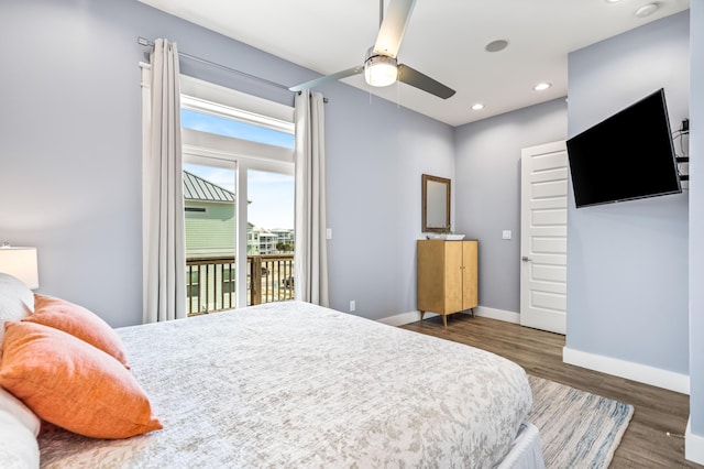 bedroom featuring ceiling fan, access to exterior, and dark hardwood / wood-style flooring