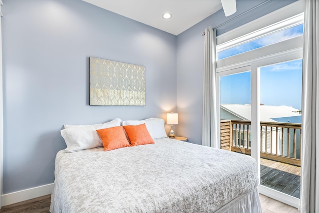 bedroom featuring access to exterior and wood-type flooring