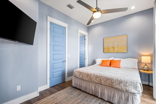 bedroom featuring ceiling fan and hardwood / wood-style floors