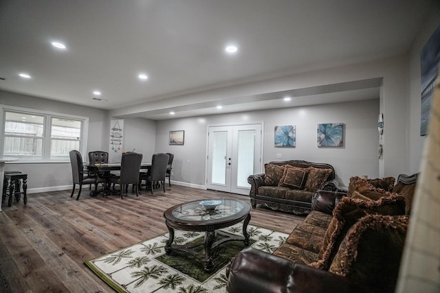 living room with french doors and hardwood / wood-style flooring