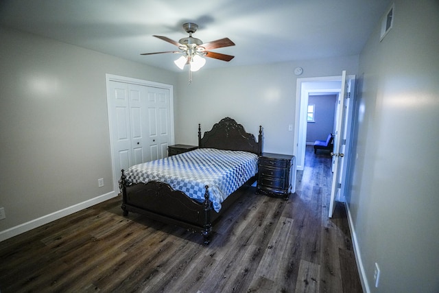 bedroom with a closet, ceiling fan, and dark wood-type flooring