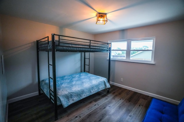 unfurnished bedroom featuring dark hardwood / wood-style flooring