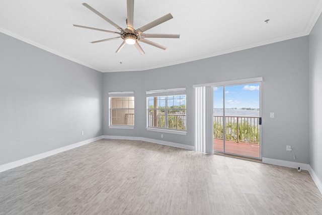 empty room featuring hardwood / wood-style floors, ceiling fan, and ornamental molding