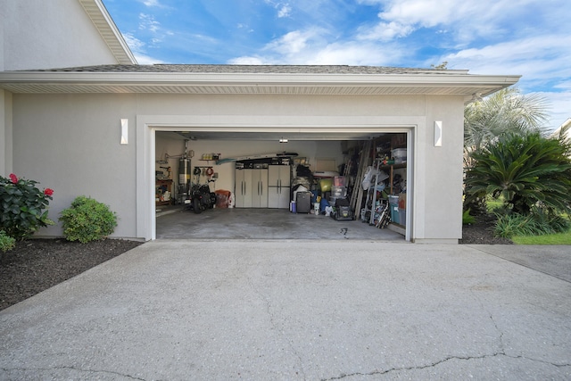 garage featuring strapped water heater