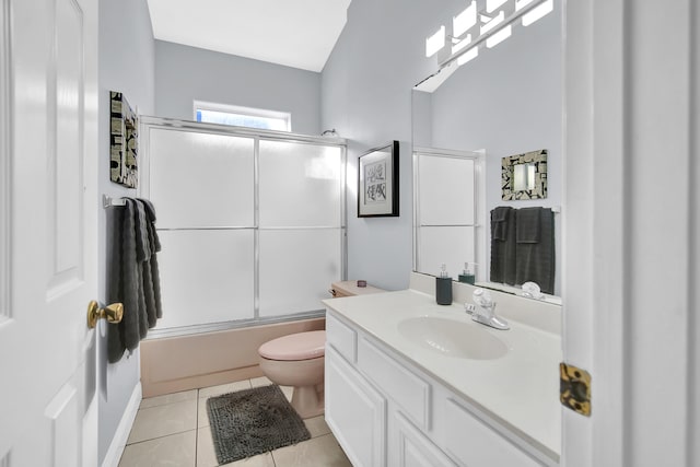 full bathroom featuring tile patterned floors, vanity, shower / bath combination with glass door, toilet, and lofted ceiling