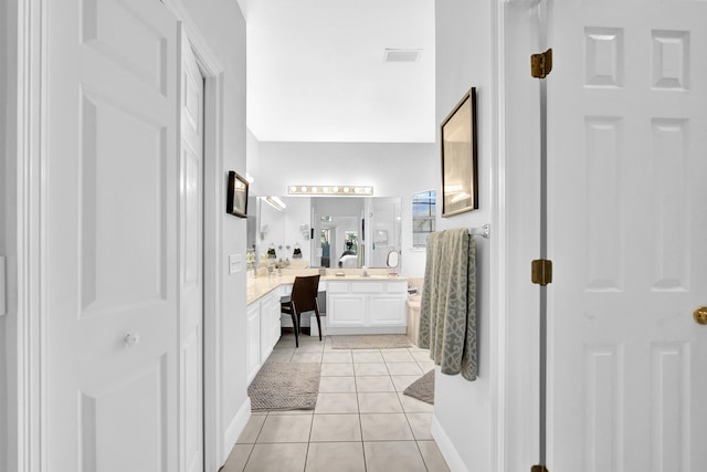 bathroom featuring tile patterned flooring and vanity