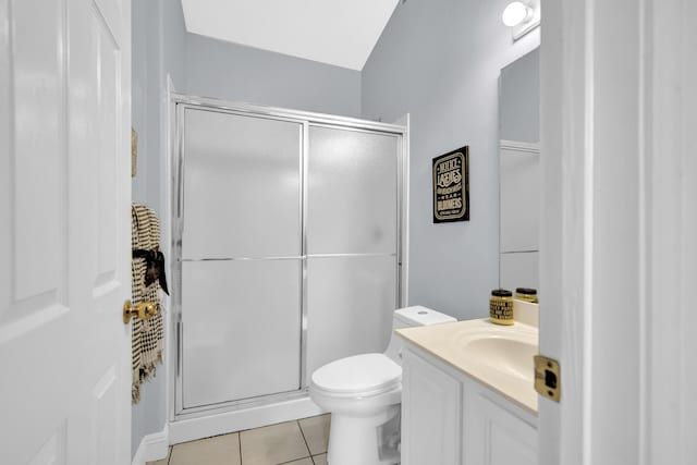 bathroom featuring tile patterned floors, an enclosed shower, vanity, toilet, and lofted ceiling